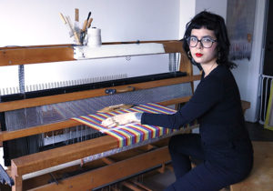 Portrait of Danielle Andress sitting at a loom